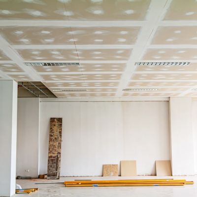 Drywall installation in California construction site